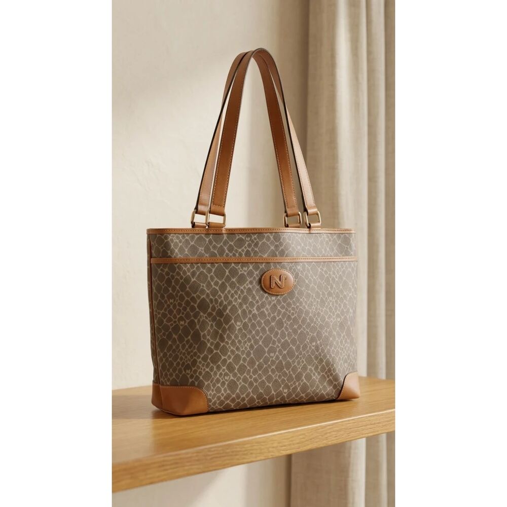 Nina Ricci Taupe grey with cognac tan trim Coated canvas body with leather trim